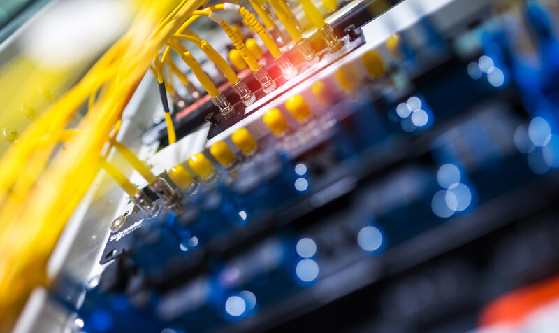 fiber optic with servers in a technology data center .